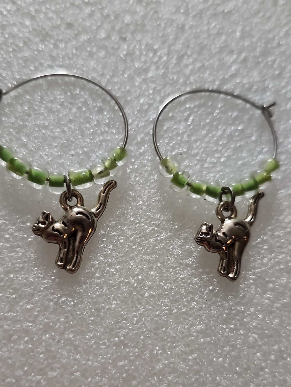 Hand Crafted Silver Cat Hoop Earrings with Light Green Beads